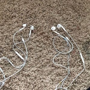 Set of two Apple headphones
